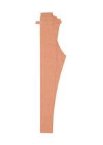 The FLAT DENIM SEASONAL pants by me ISSEY MIYAKE, in salmon pink, are neatly folded to show the side profile, waistband, and hem. Made with recycled polyester denim for an eco-friendly appeal.