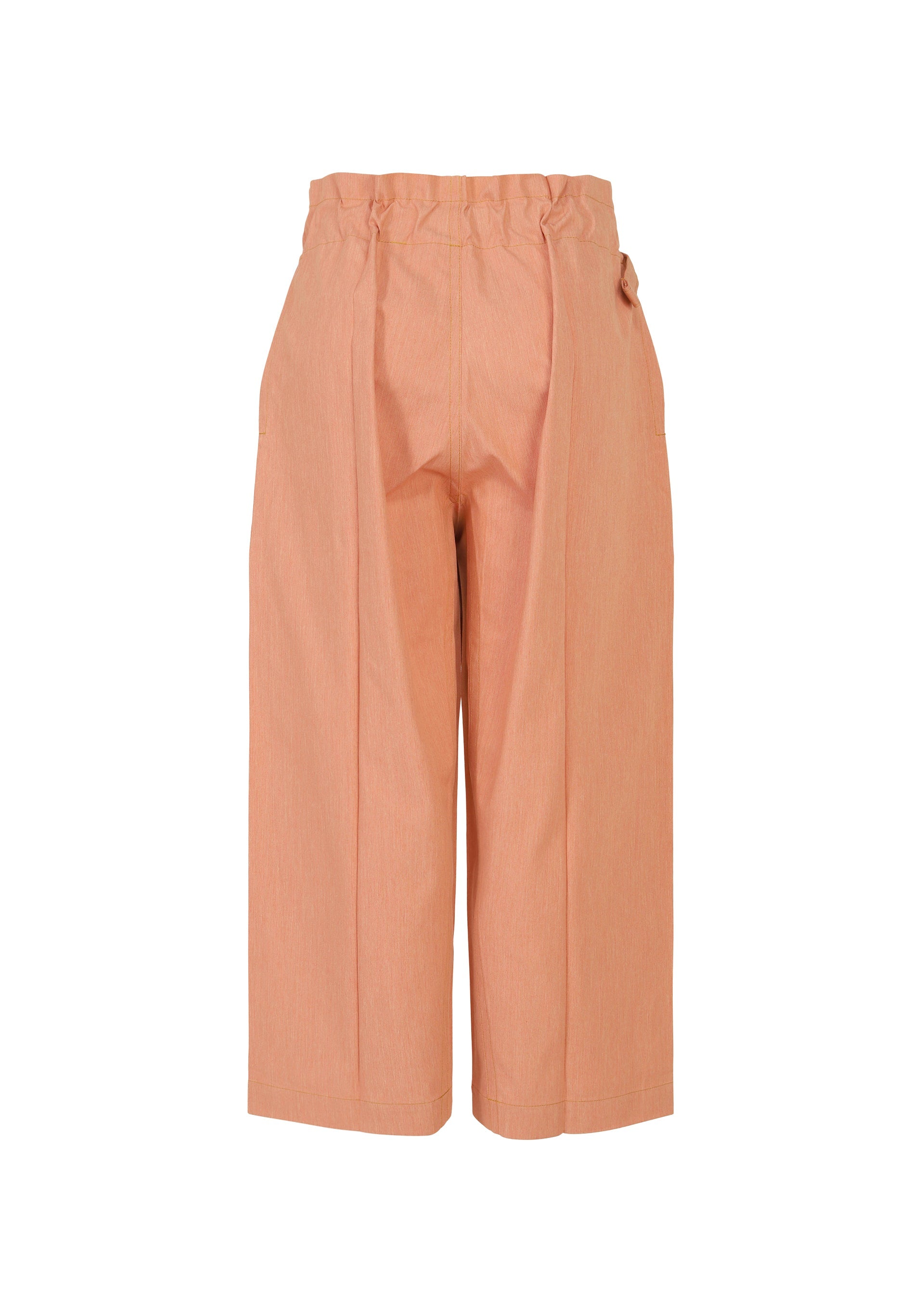 Zoomed view The FLAT DENIM SEASONAL pants by me ISSEY MIYAKE are salmon pink, high-waisted, cropped wide-leg pants with a paperbag waist, front pleats, side pockets, and a relaxed fit in recycled polyester denim.