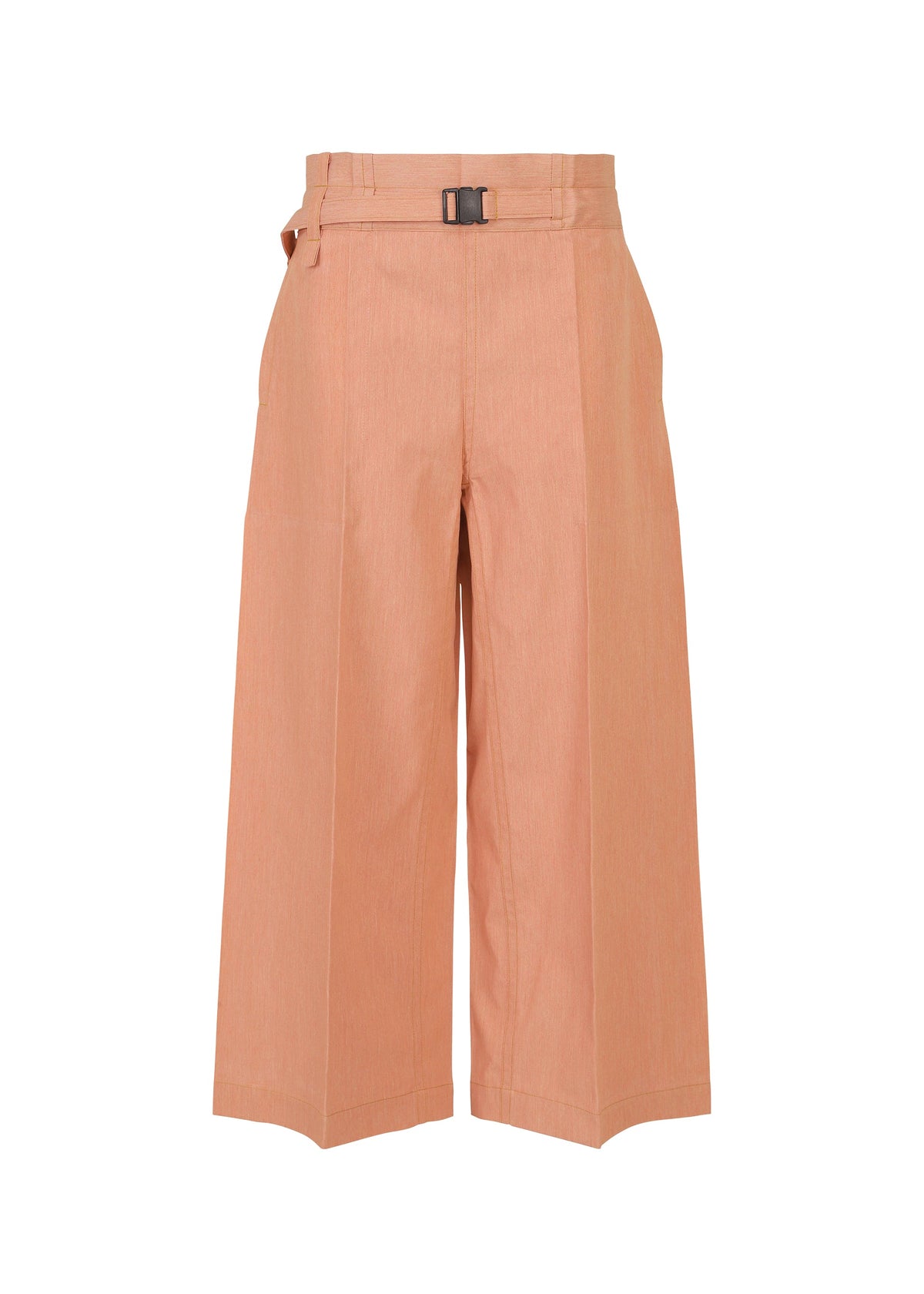 The FLAT DENIM SEASONAL pants by me ISSEY MIYAKE are high-waisted, wide-leg cropped trousers in soft salmon pink recycled polyester denim, featuring a matching belt with a rectangular metal buckle and visible front seams. view 1 of 5