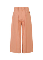 The FLAT DENIM SEASONAL by me ISSEY MIYAKE are wide-leg, high-waisted salmon pink pants in recycled polyester denim with a paperbag waistband and pleats, shown from the back against a white background.