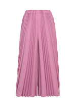 A pair of TOWER PLEATS BOTTOM wide-legged, high-waisted pink culottes by me ISSEY MIYAKE, featuring accordion-style pleats and an elastic waistband, displayed against a white background. - ROSE PINK （no.20）