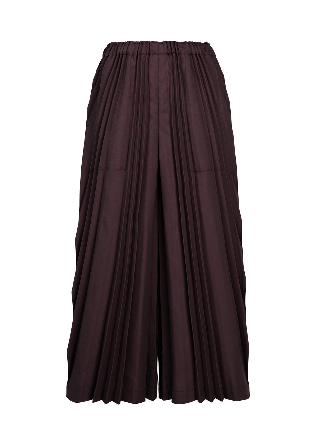 The TOWER PLEATS BOTTOM by me ISSEY MIYAKE are wide-legged skirt-pants in a dark brown hue, showcasing handmade pleating and an elastic waistband, displayed against a plain white background. view 3 of 7