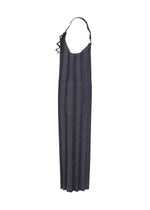A long, dark gray, pinstriped “DENIM PLEATS BOTTOM” by me ISSEY MIYAKE, crafted from recycled polyester denim with a large front pocket and adjustable neck strap, is displayed against a white background.