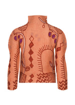The PLANT top by me ISSEY MIYAKE is a high-neck, long-sleeve turtleneck featuring an abstract design in brown, red, and purple tones with geometric and organic shapes that evoke a subtle plant motif on a beige background.