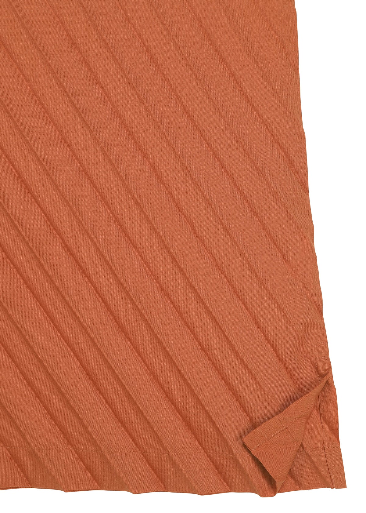A burnt orange, diagonally striped fabric with a folded lower right corner reveals intricate texture and stitching details—ideal for crafting the ANGLE PLEATS SHIRT from me ISSEY MIYAKE, a versatile piece that emphasizes both style and comfort. view 5 of 8