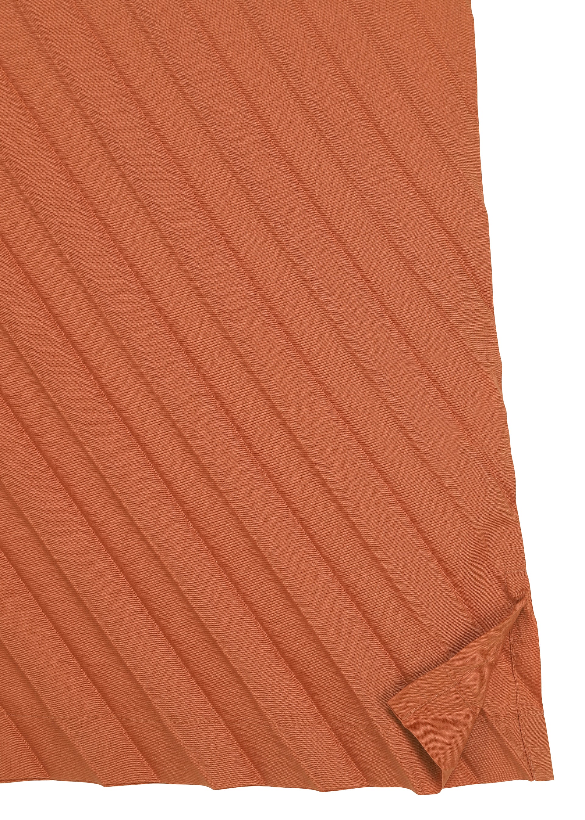 Zoomed view A burnt orange, diagonally striped fabric with a folded lower right corner reveals intricate texture and stitching details—ideal for crafting the ANGLE PLEATS SHIRT from me ISSEY MIYAKE, a versatile piece that emphasizes both style and comfort.