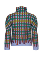 The TAPE CHECK by me ISSEY MIYAKE is a long-sleeve, high-neck top with a colorful plaid pattern and soft, pleated stretchy fabric on a white background.
