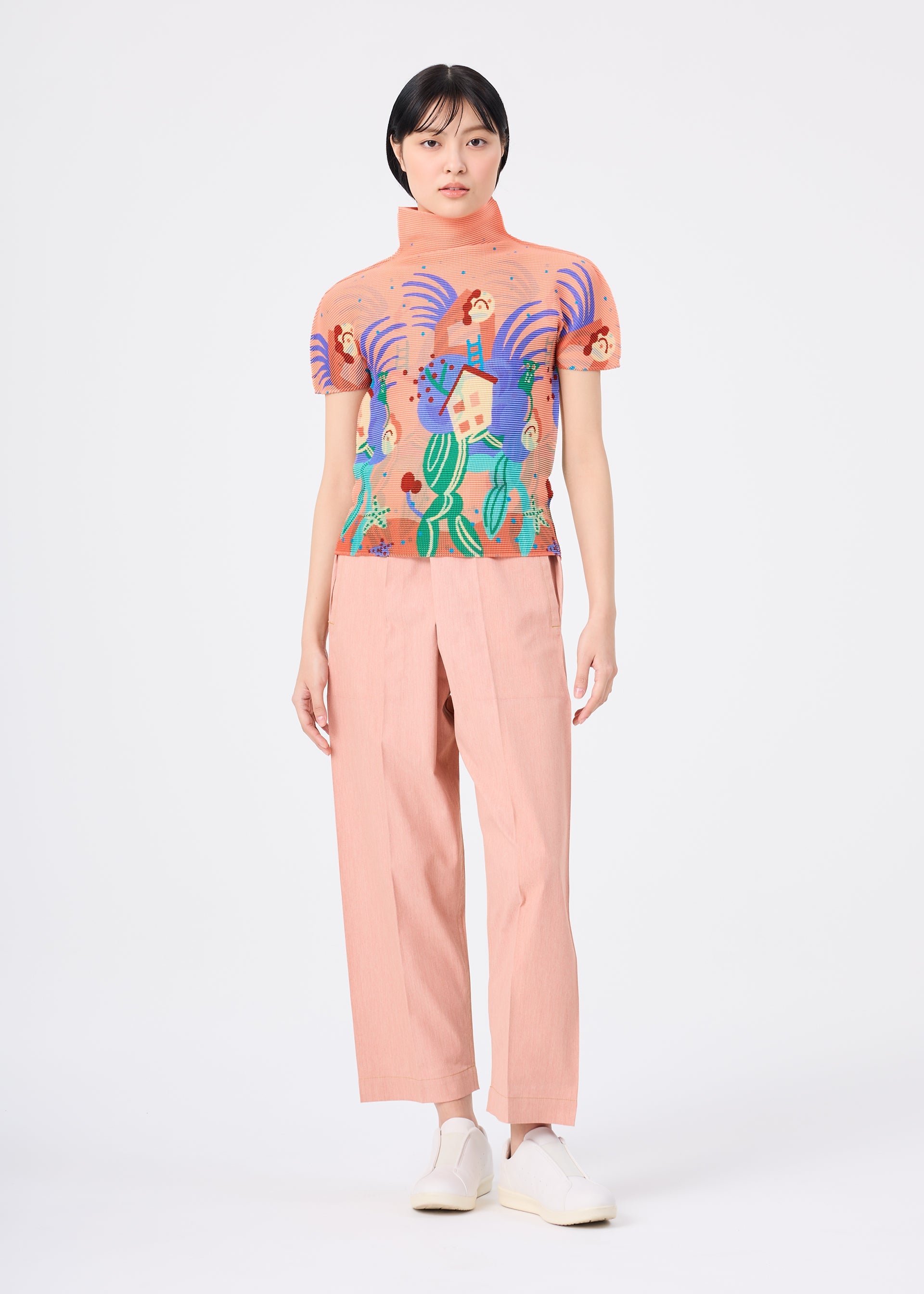 Zoomed view Against a white background, a person wears light pink wide-leg pants, white shoes, and the ISLAND high-neck stretchy top from me ISSEY MIYAKE, featuring an abstract pattern with people, plants, waves, and playful Philippines tarsiers.