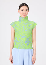 A woman with straight dark hair tied back wears the STARFISH high-neck top from me ISSEY MIYAKE, featuring a blue starfish pattern and stretch pleats, paired with light blue pleated pants against a plain white background.