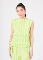 A person with long, dark hair in a high ponytail wears the light green TREE PLEATS sleeveless top and matching pants by me ISSEY MIYAKE, featuring hand pleating and geometric 3D patterns, standing against a plain white background.