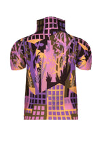 A short-sleeved, high-neck BUILDING top by me ISSEY MIYAKE, crafted with stretch pleats and showcasing a purple, pink, and black abstract cityscape and foliage pattern.
