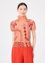 A woman stands against a plain white background wearing the “PLANT” high-neck short-sleeve top by me ISSEY MIYAKE, featuring an abstract red and purple plant pattern in peach, paired with pleated red pants.