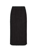 The CORDUROY PLEATS skirt by me ISSEY MIYAKE is a black, knee-length piece with a vertical ribbed texture, elastic waistband, and straight silhouette, shown against a white background. - BLACK （no.15）