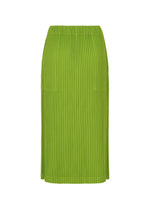 The CORDUROY PLEATS by me ISSEY MIYAKE is a green, knee-length pleated skirt with a straight silhouette, elastic waistband, and handy pockets, shown on a plain white background.