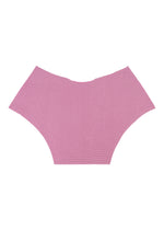 A pair of pink TOWER KNIT STRETCH PLEATS underwear by me ISSEY MIYAKE is laid flat on a white background, displaying the seamless full front and sides. Made from a soft, textured knit fabric, this piece delivers exceptional everyday comfort.