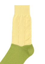 FRUITS SOCKS by me ISSEY MIYAKE: a unique knit sock with a light green foot and a pale yellow ribbed, textured upper, shown on a white background.