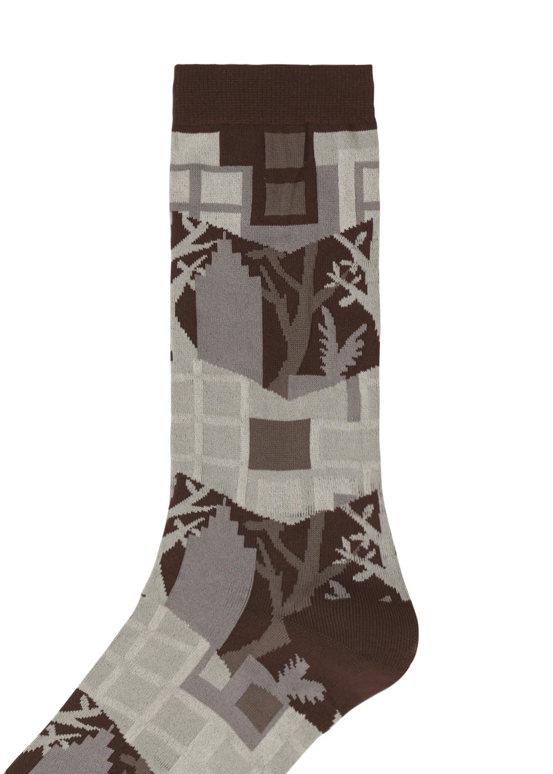 Zoomed view Introducing the BUILDING SOCKS by me ISSEY MIYAKE—these brown and gray socks showcase an abstract geometric pattern inspired by both nature and cityscapes, with shapes reminiscent of leaves and trees arranged in a dynamic, repeating design. Perfect for those who appreciate the harmony between urban living and the outdoors, these socks add a touch of nature-inspired city style to your everyday wardrobe.