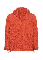 The MERINGUE PARKA by me ISSEY MIYAKE is a textured, orange hooded jacket crafted from recycled polyester, featuring a crinkled, wrinkled finish. Shown from the back against a white background, this packable design offers on-the-go style and convenience.