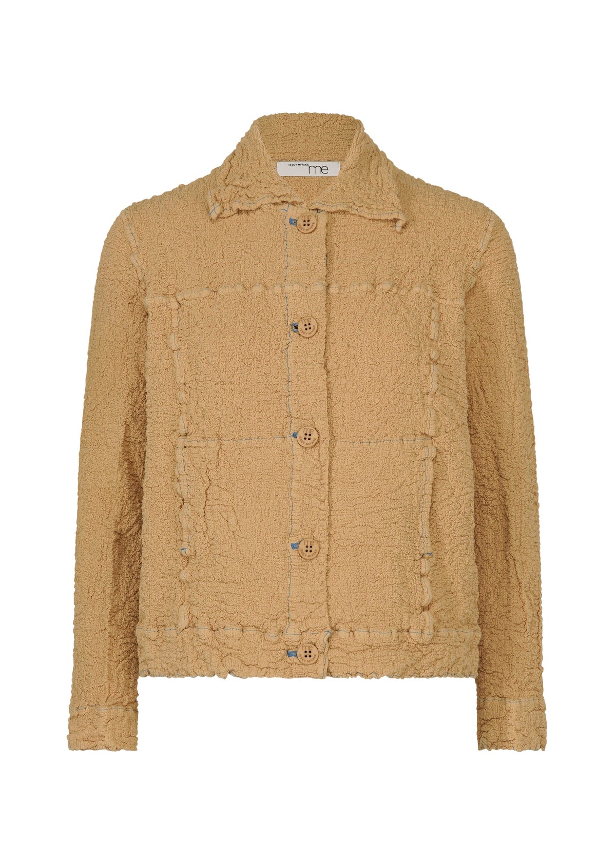 The CAULIFLOWER COLOR 1 jacket by me ISSEY MIYAKE is a beige, textured cotton button-up with a collar, visible seam details, large front pockets, and wooden buttons. view 2 of 8