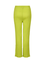 The SEE-THROUGH CREPE COLOR pants by me ISSEY MIYAKE feature bright lime green, product-dyed fabric with an elastic waistband, straight-leg cut, and slightly flared hems in high-twist thread, shown against a plain white background.