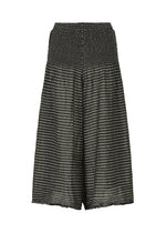 STRIPE CAULIFLOWER by me ISSEY MIYAKE are wide-leg, knee-length culottes crafted from a black and gray horizontally striped fabric. Featuring a smocked elastic waistband and a loose, flowy fit, these culottes offer cotton comfort with their lightweight and semi-sheer material.