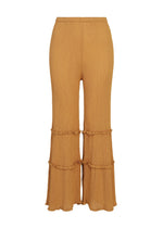 The FLARE SEE-THROUGH CREPE pants by me ISSEY MIYAKE are high-waisted, wide-leg trousers in mustard yellow, featuring two horizontal ruffle accents on each leg and a crinkled, garment-dyed crepe texture, displayed against a white background. - ONION BROWN （no.46）