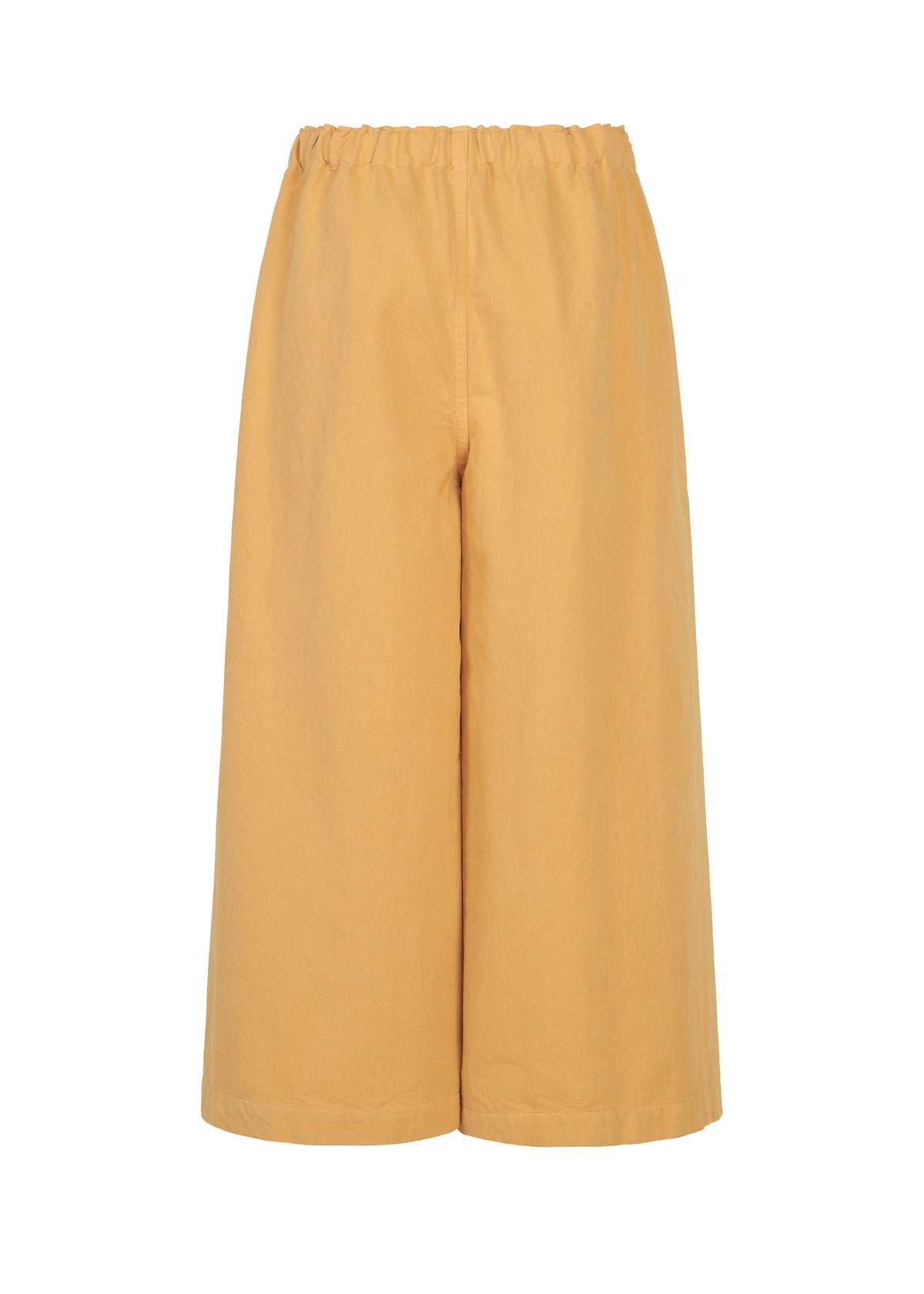 PINA CLOTH wide-leg, cropped pants in light brown by me ISSEY MIYAKE, featuring an elastic waistband and effortlessly styled with a garment-dyed jacket, displayed against a plain white background. view 3 of 6