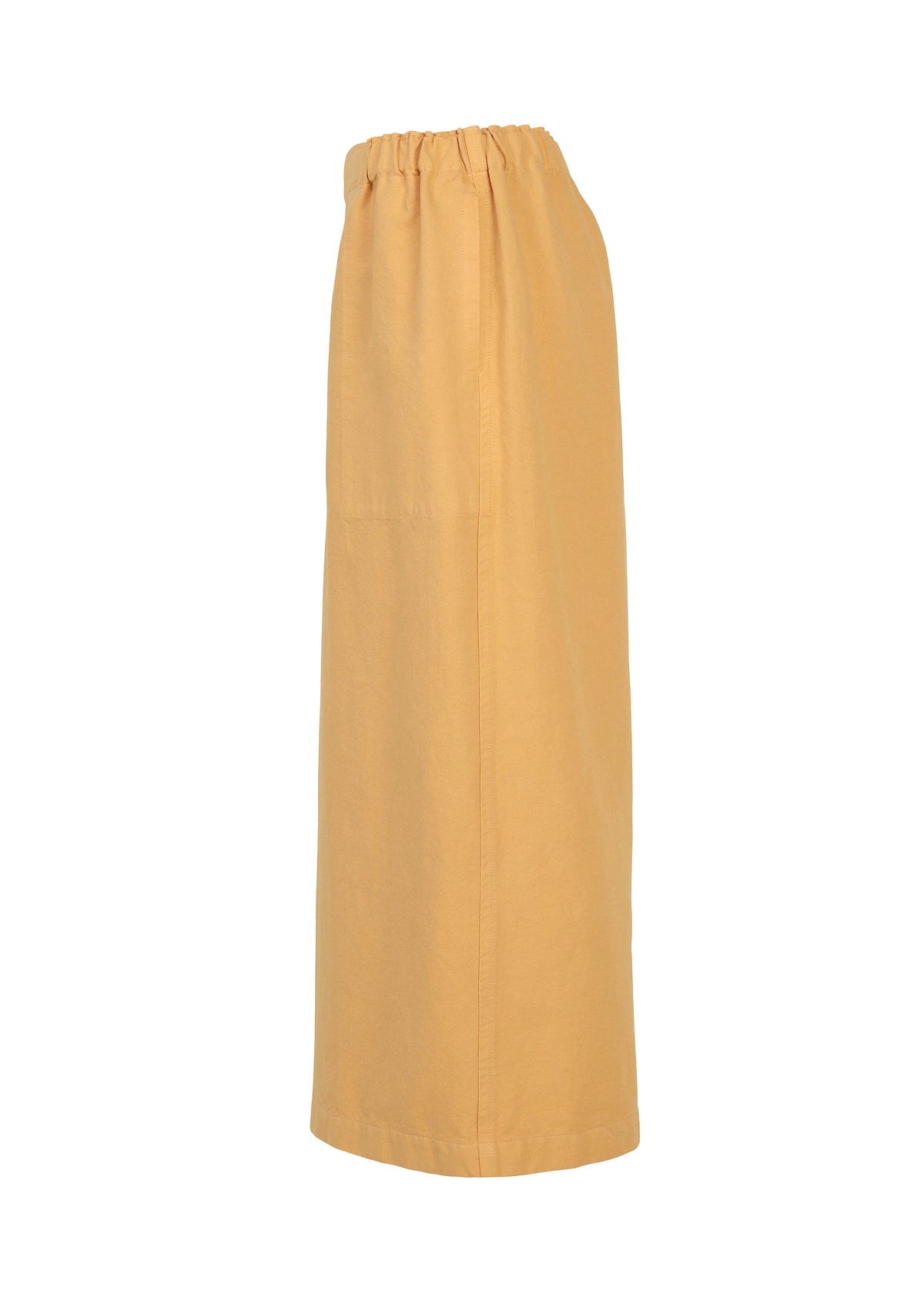 A long, straight, light orange PINA CLOTH skirt by me ISSEY MIYAKE, featuring an elastic waistband and shown from the side against a plain white background, pairs beautifully with a garment-dyed jacket for a stylish and cohesive look. view 4 of 6