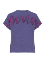 The LEAF TULLE CAULIFLOWER top by me ISSEY MIYAKE is a short-sleeve purple cotton piece showcasing a relaxed square silhouette, with pink ruffled trim creating a wavy design along the front and sleeves, accented by delicate tulle tape embroidery for extra texture. - PURPLE （no.81）