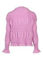 A long-sleeved, light pink SHRINK STRIPE blouse by me ISSEY MIYAKE, featuring ruffled and smocked detailing, a loose high neckline, and flared cuffs, pairs beautifully with a cotton blend cardigan.