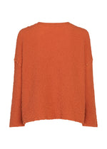 The LEAF TULLE CAULIFLOWER cardigan by me ISSEY MIYAKE is a textured, long-sleeve piece in orange cotton, showcased from the back against a white background, and distinguished by subtle tulle tape embroidery for added dimension.