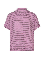 A STRIPE MERINGUE T-SHIRT by me ISSEY MIYAKE, featuring short sleeves, a button-up front, a pink hue with horizontal dark stripes, and a crinkled crushed finish texture, is displayed against a white background. - PINK-HUED （no.27）