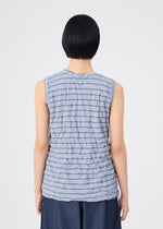 A person with short black hair is seen from the back against a plain light background, wearing the STRIPE MERINGUE T-SHIRT by me ISSEY MIYAKE—a sleeveless, textured light gray top—paired with dark pants.