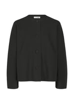 The SOLID KNIT by me ISSEY MIYAKE is a black, long-sleeve button-up cardigan with a round neckline and four front buttons, shown garment-dyed against a white background. - BLACK （no.15）