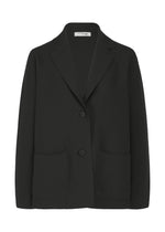 The SOLID KNIT by me ISSEY MIYAKE is a black garment-dyed jacket with two front buttons, notched lapel, and large pockets, made from recycled polyester—perfect for elevating formal looks. Shown on a white background. - BLACK （no.15）