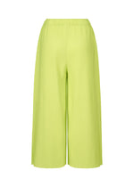 The MESH PLEATS pants by me ISSEY MIYAKE feature a wide-leg silhouette in lime green with fine knit pleats and an elastic waistband, crafted from lightweight knit fabric and shown against a white background.