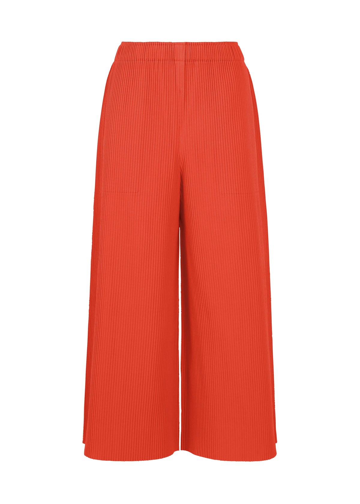 FINE KNIT PLEATS COLOR 2 wide-leg pleated culotte pants by me ISSEY MIYAKE, featuring a vibrant orange knit fabric and an elastic waistband, are displayed on a plain white background. view 2 of 7