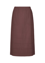 The FINE KNIT PLEATS BOTTOM 1 from me ISSEY MIYAKE is a brown, knee-length skirt featuring a subtle vertical pleated texture with horizontal dotted lines. Designed with an elastic waistband and no visible fasteners or embellishments, the skirt is showcased against a plain white background. - BORDEAUX （no.84）