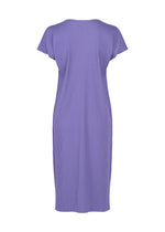 A back view of the FINE KNIT PLEATS COLOR 2 dress by me ISSEY MIYAKE showcases a short-sleeve, knee-length, purple ribbed design with a straight cut and minimalistic style; this lightweight knit dress offers effortless comfort and elegance.