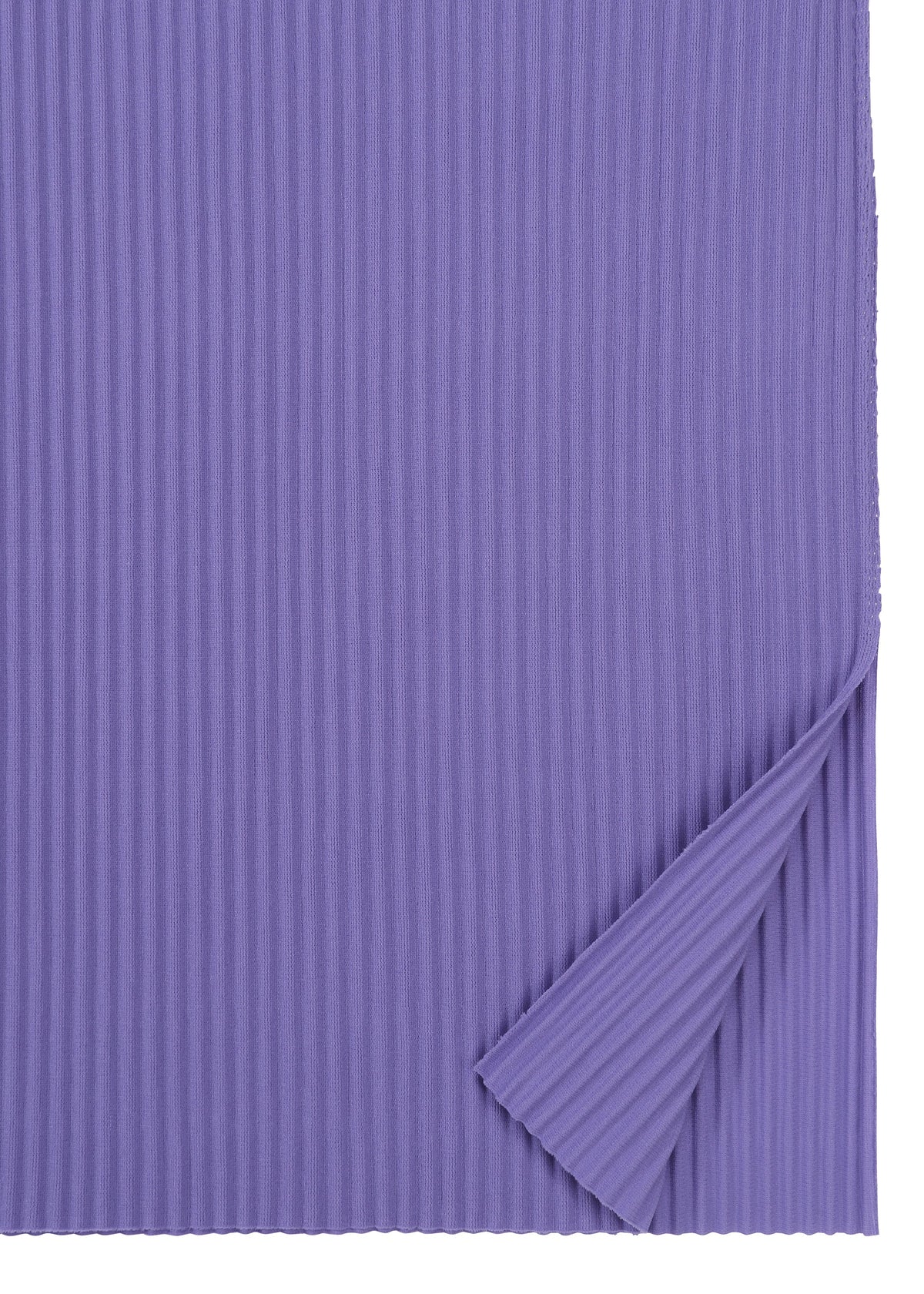 A sheet of corrugated paper in a rich purple, featuring vertical ridges and partially folded at the bottom right corner to reveal its texture and flexibility—evoking the delicate structure of the FINE KNIT PLEATS COLOR 2 dress by me ISSEY MIYAKE. view 6 of 9