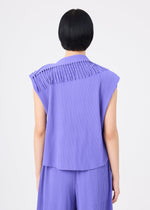 A person with short black hair is seen from behind against a plain white background, wearing the me ISSEY MIYAKE LEAF PLEATS set—a sleeveless, fine-knit pleated lavender top paired with matching pants.