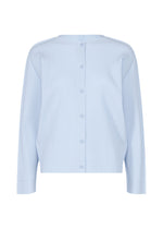 The FINE KNIT PLEATS COLOR 1 by me ISSEY MIYAKE is a light blue, long-sleeved cardigan with back buttons, subtle vertical stripe pleats, fine knit texture, lightweight feel, a relaxed fit, and no visible collar. - FOGGY BLUE （no.71）