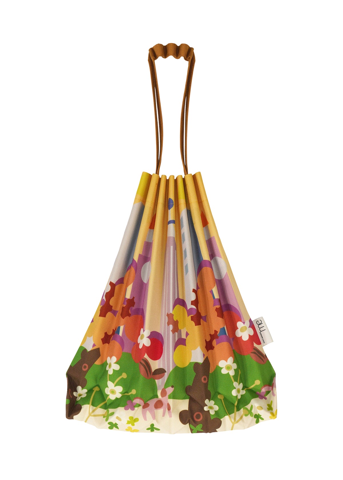 Zoomed view The TRUNK PLEATS BAG / NY by me ISSEY MIYAKE is a pleated mini tote with brown handles, an orange, green, pink, and white floral pattern, and a small side tag inspired by Madison Square Park.