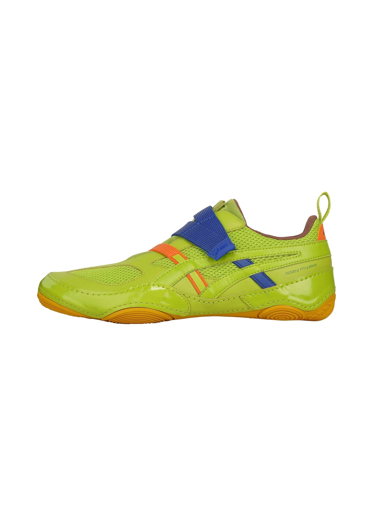The HYPER TAPING by ISSEY MIYAKE FOOT is a bright green sneaker with orange and blue accents, featuring a blue athletic-inspired strap across the upper and an orange sole, set against a white background. view 2 of 6