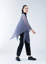 A person wearing black clothes and shoes, styled with the PLEATS PLEASE ISSEY MIYAKE BASIC MADAME-T SMALL, a sheer pleated asymmetrical lavender poncho, stands against a plain light background.