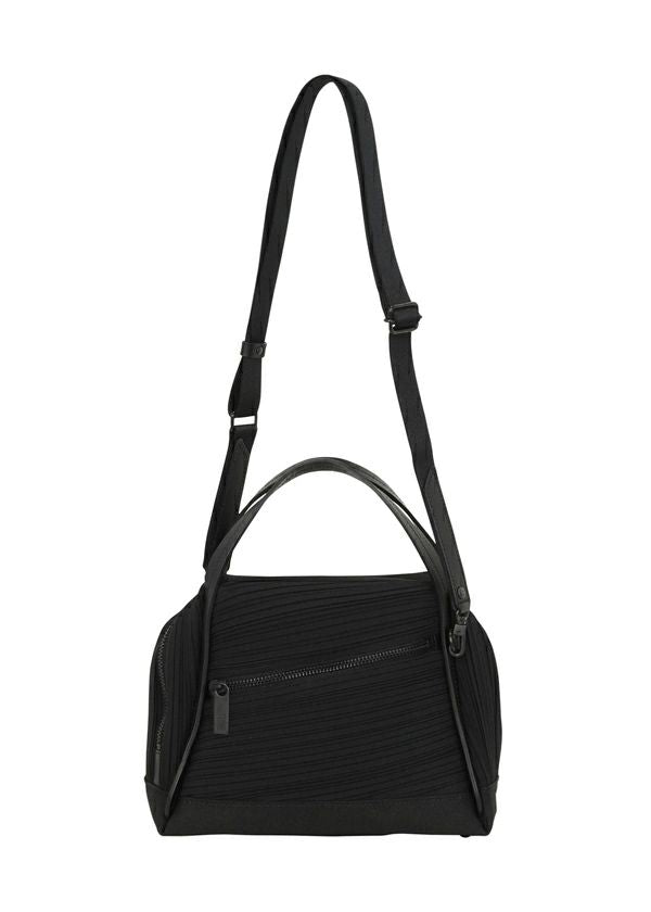 Zoomed view The BIAS PLEATS BAG by PLEATS PLEASE ISSEY MIYAKE is a black pleated bag with a textured surface, top handle, shoulder strap, and front zippered pocket. - BLACK (no.15)