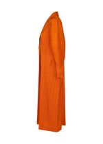 Side view of the MONTHLY COLORS : DECEMBER long, bright orange pleated coat by PLEATS PLEASE ISSEY MIYAKE, shown on a white background. Features dolman sleeves, a collar, and lightweight ribbed fabric for stylish texture.