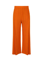 The MONTHLY COLORS : DECEMBER pants by PLEATS PLEASE ISSEY MIYAKE feature bright orange pleated wide-leg design, tucks, and an elastic waistband, shown against a white background. - ORANGE （no.32）