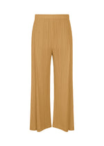 The MONTHLY COLORS : DECEMBER pleated wide-leg pants from PLEATS PLEASE ISSEY MIYAKE feature a tan hue, tucks, an elastic waistband, and pockets, shown against a white background. - YELLOW OCHER （no.55）
