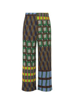 The HARMONY wide-leg pants by PLEATS PLEASE ISSEY MIYAKE feature a bold geometric patchwork in green, blue, brown, yellow, and red on white with an elastic waistband—perfect statement printed pants for any wardrobe. - BLUE （no.72）